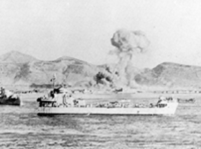 A warship with soldiers and refugees on board at the port of Hungnam